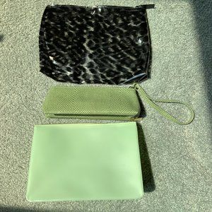 Three makeup bags; Estée Lauder, Clinique and Walgreens
